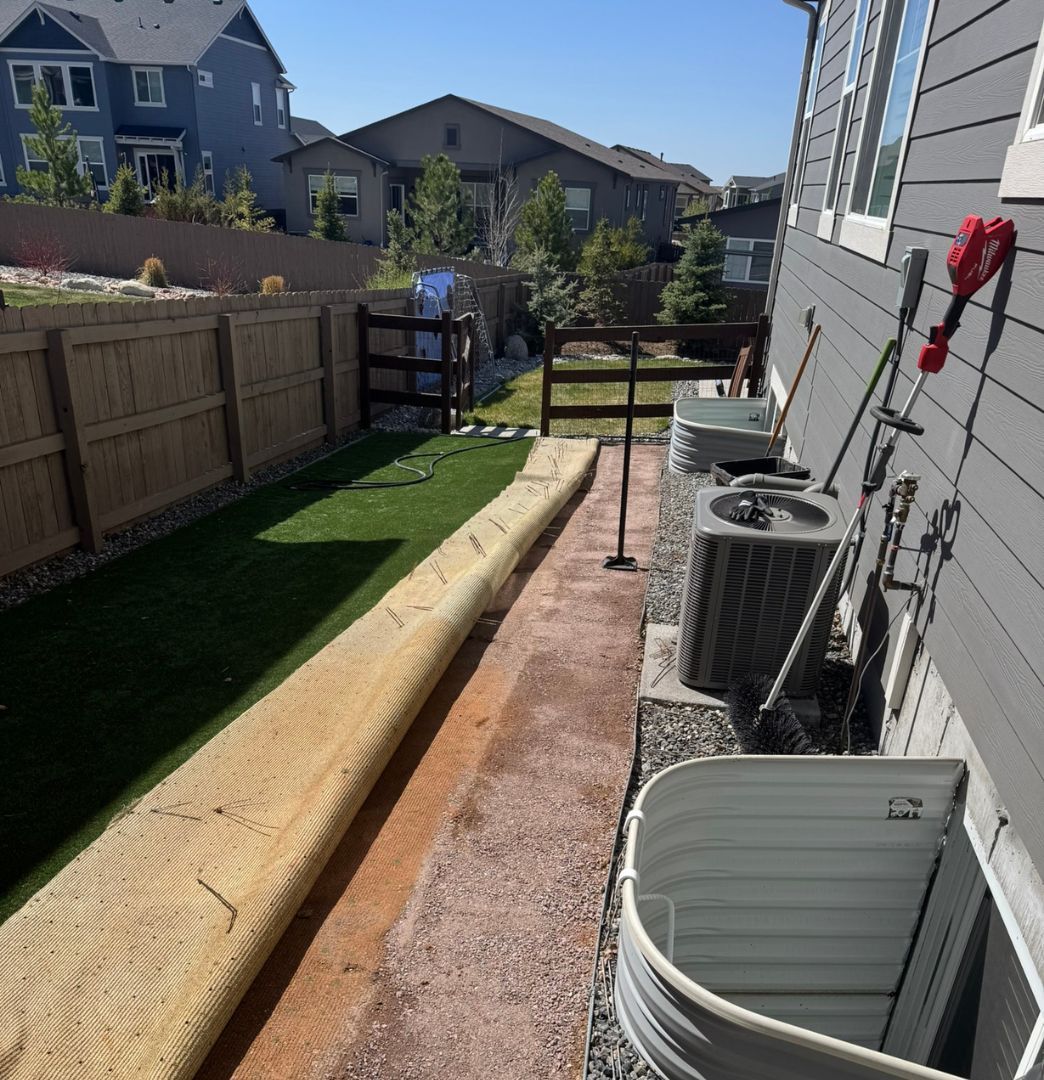 cleaning turf with a vacuum to prepare for repair